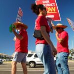 Kaiser mental health workers gathered outside the Kaiser Permanente San Diego Medical Center with signs and whistles to get care for cars passing through Kearny Mesa on Monday, Oct. 21. 2024 San Diego, California. (Alejandro Tamayo / The San Diego Union-Tribune)